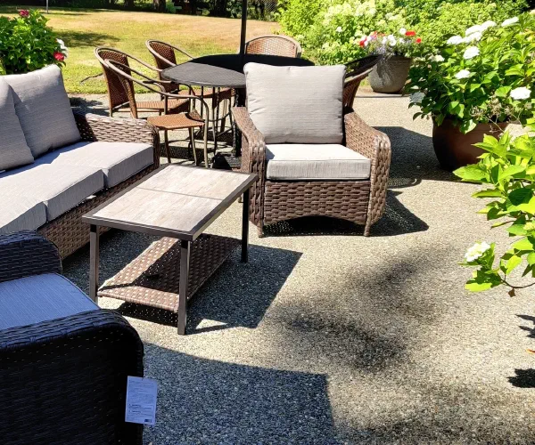 Completed outdoor patio furniture set arranged on a patio