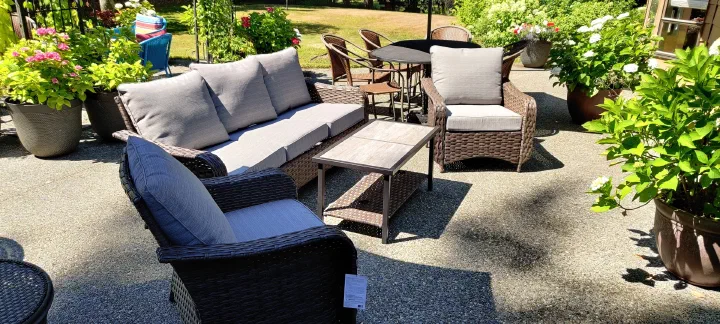 Completed outdoor patio furniture set arranged on a patio
