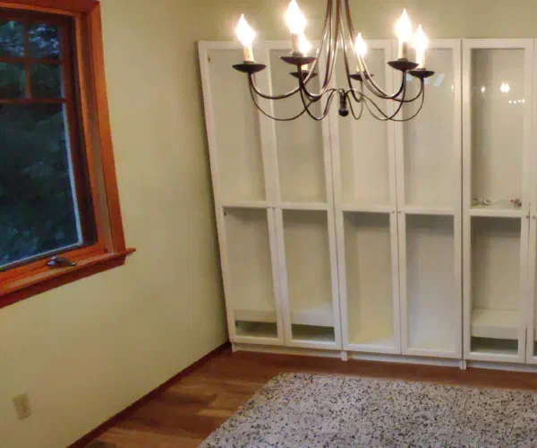 Completed wall of white display cabinets