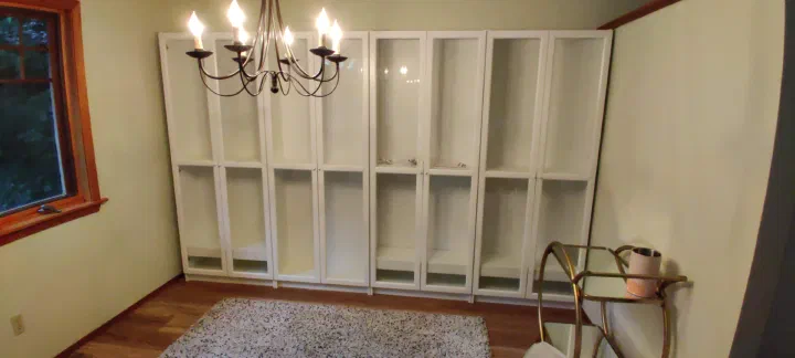 Completed wall of white display cabinets
