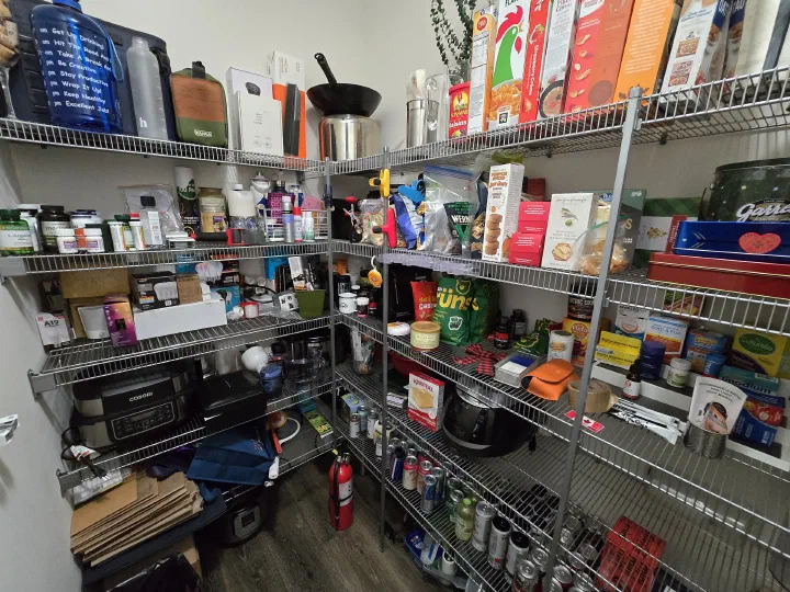 Client pantry after organization with clear grouped storage
